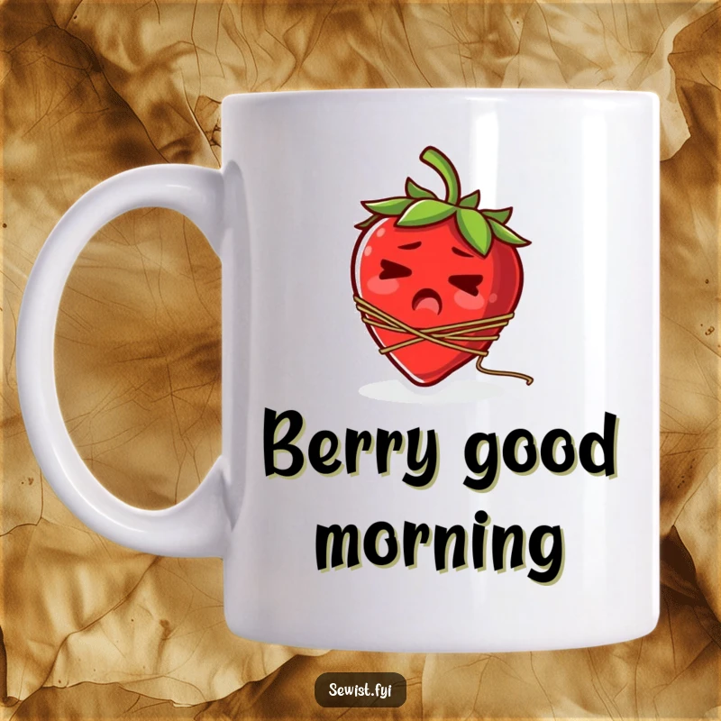 Funny mug depicting a startled strawberry hilariously tangled in a spool of thread around its stem.