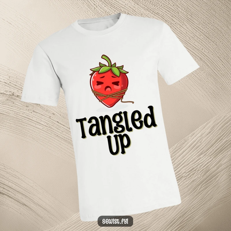Funny t-shirt showing a startled strawberry with a spool of thread comically tangled around its stem.