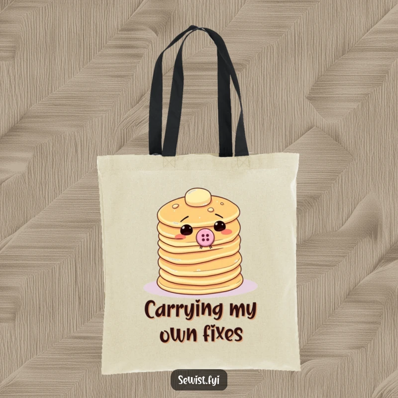 Funny tote bag featuring a wobbly stack of pancakes trying to sew a giant button onto itself, perfect for carrying craft supplies.