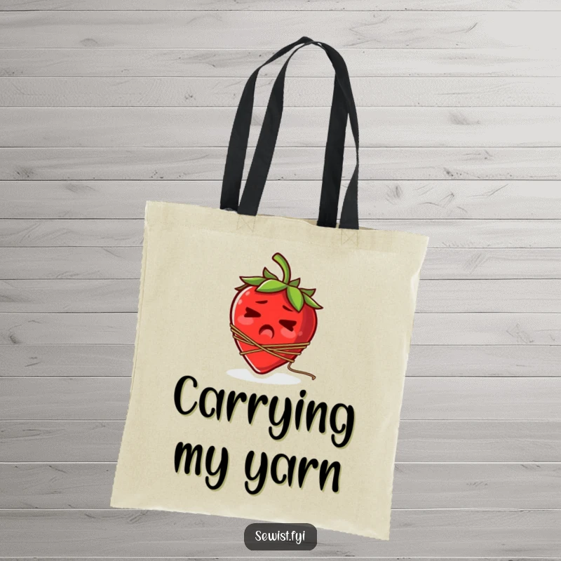 Funny tote bag showing a startled strawberry with a spool of thread tangled around its stem.